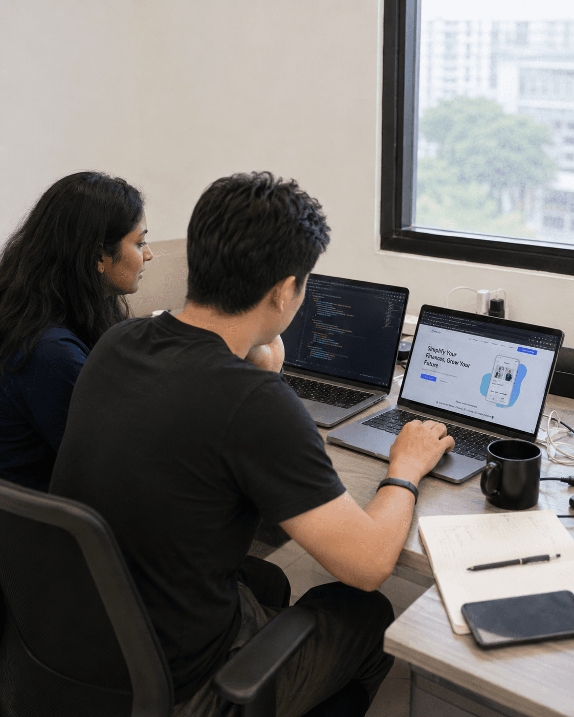 Two Made Proper builders pair-working at a laptop