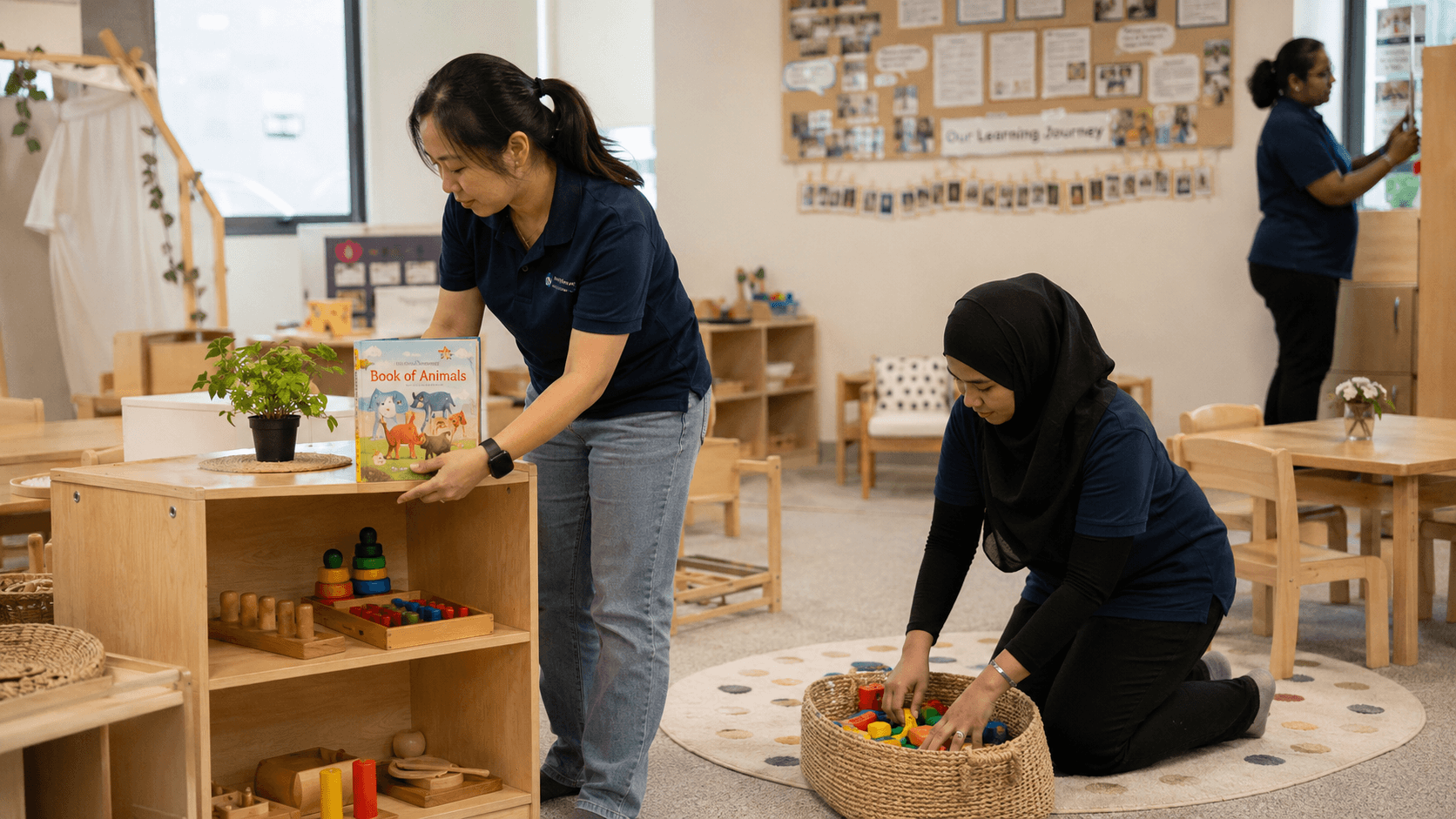Childcare playroom with low shelves of wooden toys